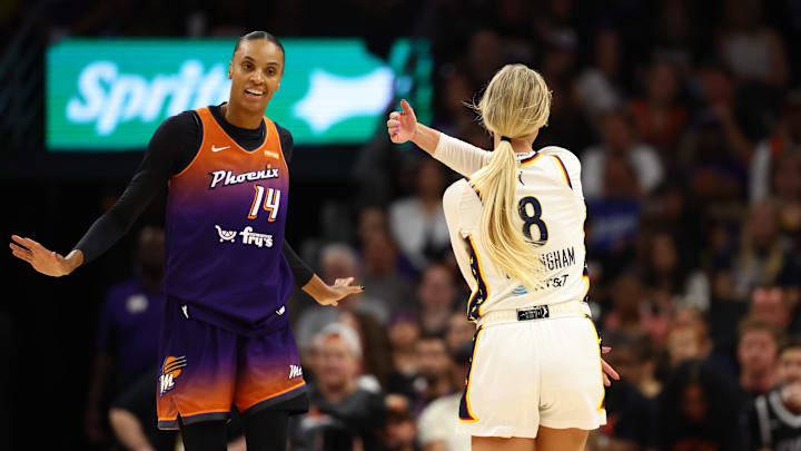 Aug 7, 2025; Phoenix, Arizona, USA; Indiana Fever guard Sophie Cunningham (8) reacts alongside Phoenix Mercury forward DeWanna Bonner (14) in the first half of a WNBA game at PHX Arena. Mandatory Credit: Mark J. Rebilas-Imagn Images
