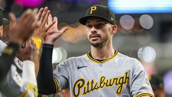 Sep 27, 2025; Cumberland, Georgia, USA; Pittsburgh Pirates outfielder Bryan Reynolds (10) high fives teammates after the victory against the Atlanta Braves at Truist Park. Sep 27, 2025; Cumberland, Georgia, USA; Pittsburgh Pirates outfielder Bryan Reynolds (10) high fives teammates after the victory against the Atlanta Braves at Truist Park.