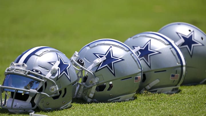Jul 26, 2023; Oxnard, CA, USA; General view of player helmets on the field during training camp at River Ridge Playing Fields in Oxnard, CA. Mandatory Credit: Jayne Kamin-Oncea-Imagn Images