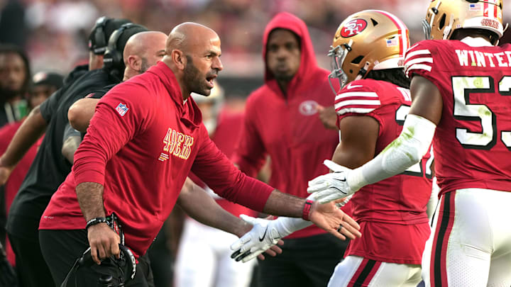 Oct 19, 2025; Santa Clara, California, USA; San Francisco 49ers defensive coordinator Robert Saleh (left) congratulates linebacker Dee Winters (right) during the second quarter against the Atlanta Falcons at Levi's Stadium. Mandatory Credit: Darren Yamashita-Imagn Images