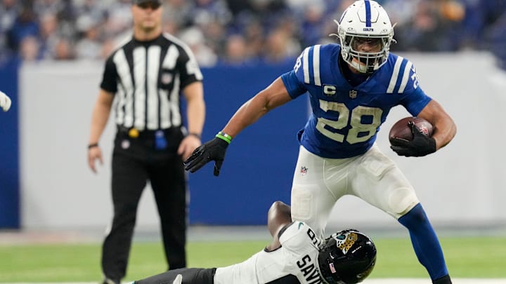 Indianapolis Colts running back Jonathan Taylor (28) is brought down by Jacksonville Jaguars safety Darnell Savage (6) on Sunday, Jan. 5, 2025, during a game against the Jacksonville Jaguars at Lucas Oil Stadium in Indianapolis.