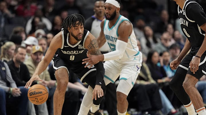 Jan 29, 2025; Charlotte, North Carolina, USA; Charlotte Hornets forward Josh Okogie (12) defends against Brooklyn Nets forward Trendon Watford (9) during the second half at Spectrum Center. Mandatory Credit: Jim Dedmon-Imagn Images Jan 29, 2025; Charlotte, North Carolina, USA; Charlotte Hornets forward Josh Okogie (12) defends against Brooklyn Nets forward Trendon Watford (9) during the second half at Spectrum Center. Mandatory Credit: Jim Dedmon-Imagn Images