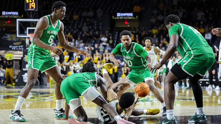 Wichita State Shockers guard Harlond Beverly (20) and North Texas Mean Green guard Rondel Walker (5)