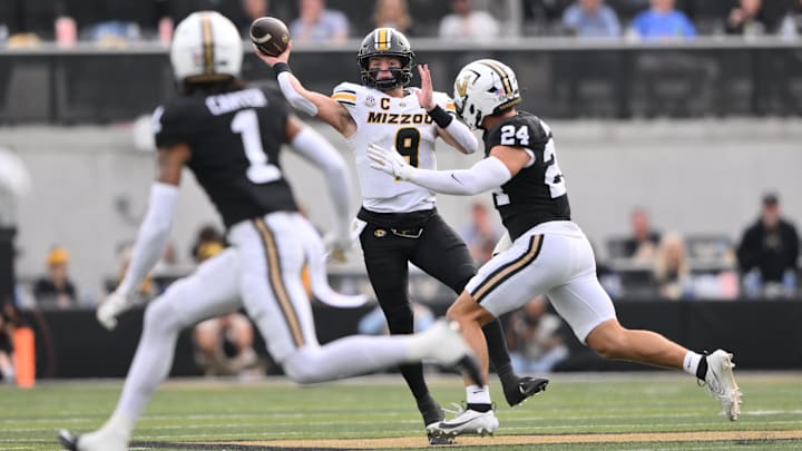 Oct 25, 2025; Nashville, Tennessee, USA; Missouri Tigers quarterback Beau Pribula (9) throws while pressured by Vanderbilt Commodores defensive lineman Nick Rinaldi (24) during the second quarter at FirstBank Stadium. Mandatory Credit: Steve Roberts-Imagn Images Oct 25, 2025; Nashville, Tennessee, USA; Missouri Tigers quarterback Beau Pribula (9) throws while pressured by Vanderbilt Commodores defensive lineman Nick Rinaldi (24) during the second quarter at FirstBank Stadium. Mandatory Credit: Steve Roberts-Imagn Images