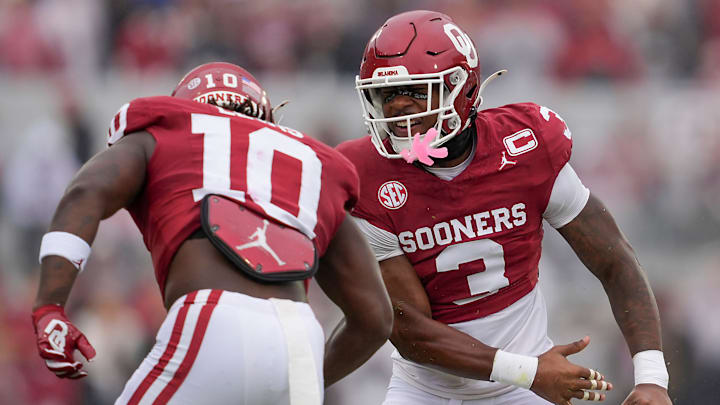 Oklahoma safety Robert Spears-Jennings celebrates with linebacker Kip Lewis.