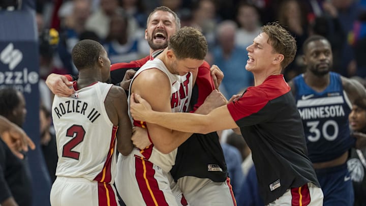 Nov 10, 2024; Minneapolis, Minnesota, USA; Miami Heat forward Nikola Jovic (5) (middle) celebrates with teammates after defeating the Minnesota Timberwolves at Target Center. Mandatory Credit: Jesse Johnson-Imagn Images