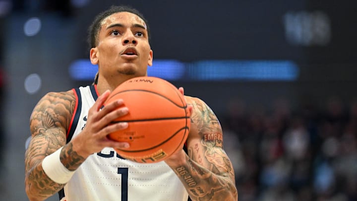 Oct 28, 2025; Hartford, CT, USA; Connecticut Huskies guard Solo Ball (1) shoots a free throw during the first half against the Michigan State Spartans at PeoplesBank Arena. Mandatory Credit: Mark Smith-Imagn Images Oct 28, 2025; Hartford, CT, USA; Connecticut Huskies guard Solo Ball (1) shoots a free throw during the first half against the Michigan State Spartans at PeoplesBank Arena. Mandatory Credit: Mark Smith-Imagn Images