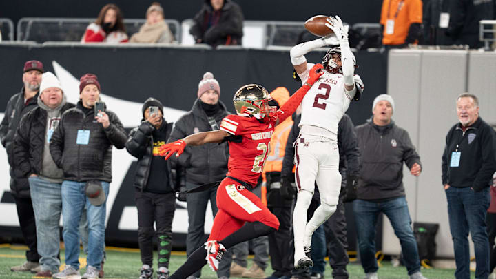Nov 29, 2024; East Rutherford, NJ, USA; Bergen Catholic vs. Don Bosco in the NJSIAA Non-Public A football final at MetLife Stadium. BC #21 Jordan Thomas breaks up a pass intended for DB #2 Isaiah Alvarez.
