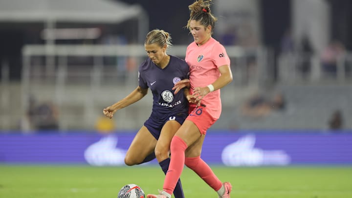 Racing Louisville FC midfielder Kayla Fischer (9) battles North Carolina Courage midfielder Riley Jackson (16) for the ball in the second half at Lynn Family Stadium 