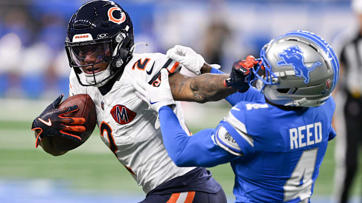 Sep 14, 2025; Detroit, Michigan, USA; Chicago Bears wide receiver DJ Moore (2) carries the ball defended by Detroit Lions cornerback D.J. Reed (4) during the first quarter of the game at Ford Field. Mandatory Credit: Lon Horwedel-Imagn Images