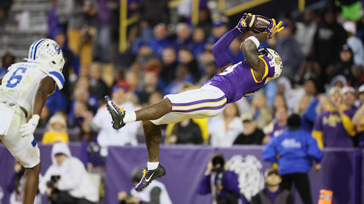 Nov 18, 2023; Baton Rouge, Louisiana, USA; LSU Tigers wide receiver Malik Nabers (8) hauls in a 40-yard touchdown pass against the Georgia State Panthers in the fourth quarter at Tiger Stadium. Mandatory Credit: Matthew Dobbins-Imagn Images Nov 18, 2023; Baton Rouge, Louisiana, USA; LSU Tigers wide receiver Malik Nabers (8) hauls in a 40-yard touchdown pass against the Georgia State Panthers in the fourth quarter at Tiger Stadium. Mandatory Credit: Matthew Dobbins-Imagn Images