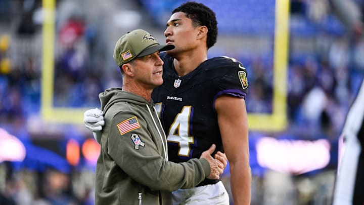 Oct 26, 2025; Baltimore, Maryland, USA; Baltimore Ravens head coach John Harbaugh greets Baltimore Ravens safety Kyle Hamilton (14) on the field after the game against the Chicago Bears at M&T Bank Stadium. Mandatory Credit: Tommy Gilligan-Imagn Images