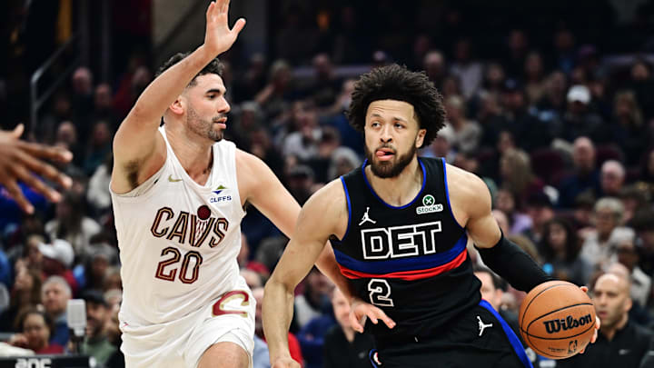 Jan 27, 2025; Cleveland, Ohio, USA; Detroit Pistons guard Cade Cunningham (2) drives to the basket against Cleveland Cavaliers forward Georges Niang (20) during the first half at Rocket Mortgage FieldHouse. Mandatory Credit: Ken Blaze-Imagn Images