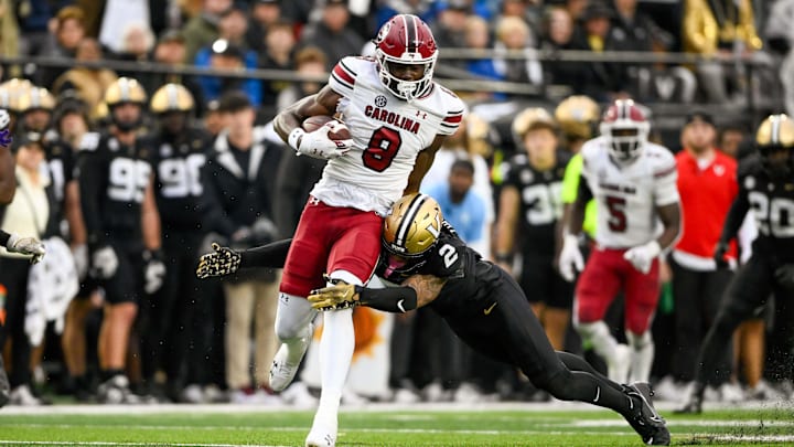 Nov 9, 2024; Nashville, Tennessee, USA;  South Carolina Gamecocks wide receiver Nyck Harbor (8) breaks the tackle of Vanderbilt Commodores linebacker Randon Fontenette (2) during the first half at FirstBank Stadium. Mandatory Credit: Steve Roberts-Imagn Images