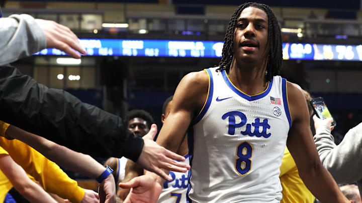 Jan 27, 2026; Pittsburgh, Pennsylvania, USA; Pittsburgh Panthers guard Omari Witherspoon (8) celebrates with the student section after defeating the Wake Forest Demon Deacons in overtime at the Petersen Events Center. Mandatory Credit: Charles LeClaire-Imagn Images