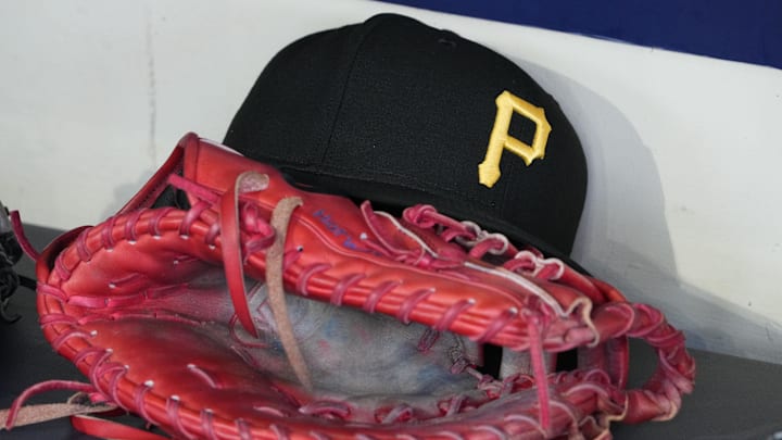 Jun 23, 2025; Milwaukee, Wisconsin, USA; against the Pittsburgh Pirates hat and glove in the dugout before a game against the Milwaukee Brewers at American Family Field. Mandatory Credit: Michael McLoone-Imagn Images Jun 23, 2025; Milwaukee, Wisconsin, USA; against the Pittsburgh Pirates hat and glove in the dugout before a game against the Milwaukee Brewers at American Family Field. Mandatory Credit: Michael McLoone-Imagn Images