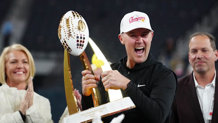 Dec 27, 2024; Las Vegas, NV, USA; Southern California Trojans head coach Lincoln Riley holds the championship trophy after the game against the Texas A&M Aggies at Allegiant Stadium. Mandatory Credit: Kirby Lee-Imagn Images