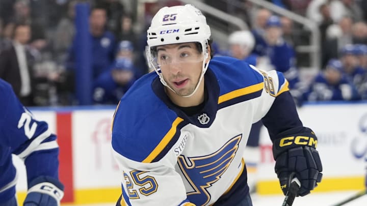 Oct 24, 2024; Toronto, Ontario, CAN; St. Louis Blues forward Jordan Kyrou (25) skates against the Toronto Maple Leafs during the second period at Scotiabank Arena. Mandatory Credit: John E. Sokolowski-Imagn Images