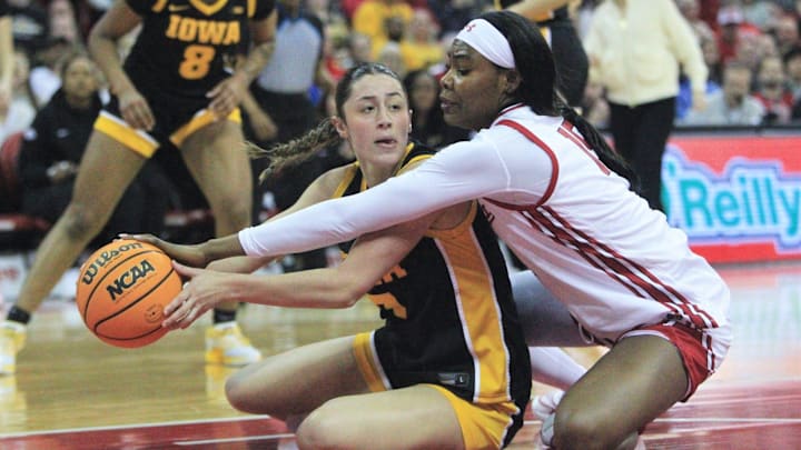 Iowa's Addie Deal tries to keep the ball away from Wisconsin's Gift Uchenna in the first half Sunday March 1, 2026 at the Kohl Center in Madison, Wis.