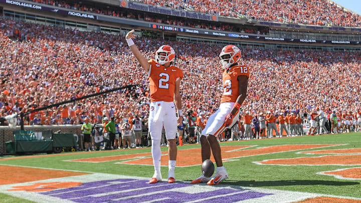 Sep 21, 2024; Clemson, South Carolina, USA; Clemson Tigers quarterback Cade Klubnik (2) waves to the crowd after running in for a touchdown against the North Carolina State Wolfpack at Memorial Stadium. 