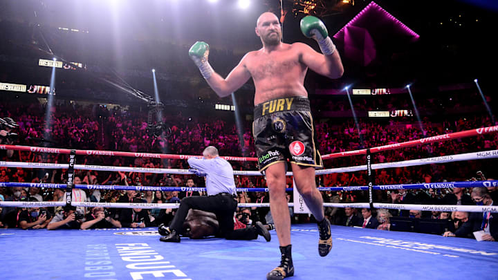Deontay Wilder (red/black trunks) is knocked out by Tyson Fury (black/gold trunks) during their WBC/Lineal heavyweight championship boxing match in 2021. Deontay Wilder (red/black trunks) is knocked out by Tyson Fury (black/gold trunks) during their WBC/Lineal heavyweight championship boxing match in 2021.