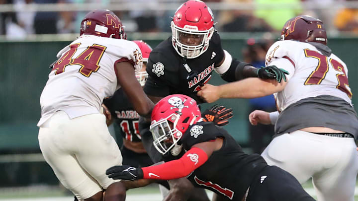 Savannah Christian's Jaden Miles and LaDamion Guyton look to stop New Hampstead's Kameron Blake-Mazes in the backfield on Friday, August 23, 2024 at Pooler Stadium.