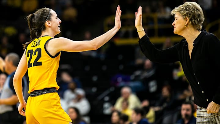 Iowa guard Caitlin Clark, left, high-fives head coach Lisa Bluder during a NCAA Big Ten Conference women's basketball game against Penn State, Saturday, Jan. 14, 2023, at Carver-Hawkeye Arena in Iowa City, Iowa.