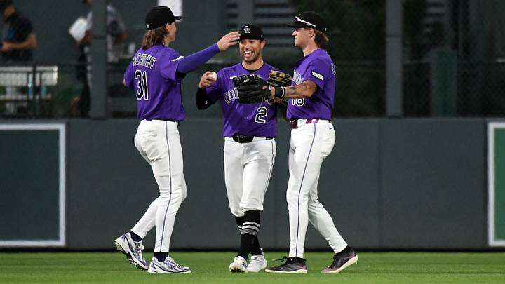 Colorado Rockies outfielder Jake McCarthy (31) outfielder Tyler Freeman (2) and outfielder Cole Carrigg (16) celebrate after a win a Colorado Rockies outfielder Jake McCarthy (31) outfielder Tyler Freeman (2) and outfielder Cole Carrigg (16) celebrate after a win a