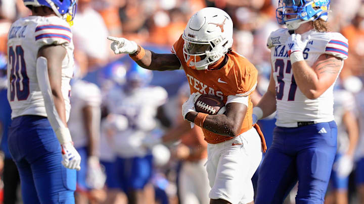 Texas Longhorns wide receiver Johntay Cook II signals first down after making a reception against the Kansas Jayhawks.