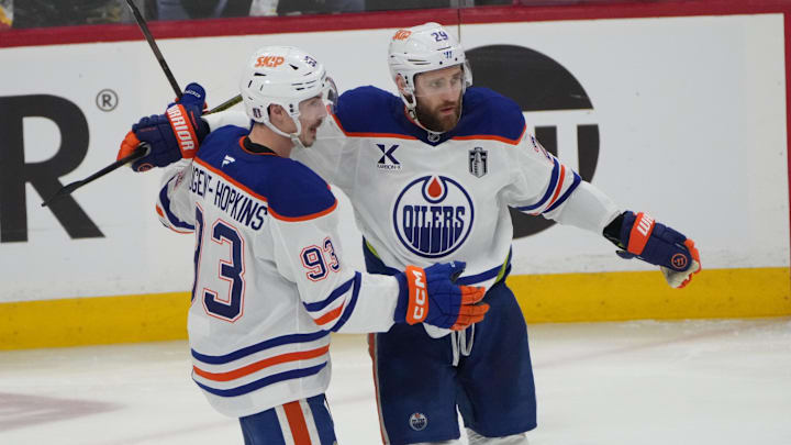 Jun 12, 2025; Sunrise, Florida, USA; Edmonton Oilers center Ryan Nugent-Hopkins (93) celebrates scoring with center Leon Draisaitl (29) during the second period against the Florida Panthers  in game four of the 2025 Stanley Cup Final at Amerant Bank Arena. Mandatory Credit: Jim Rassol-Imagn Images
