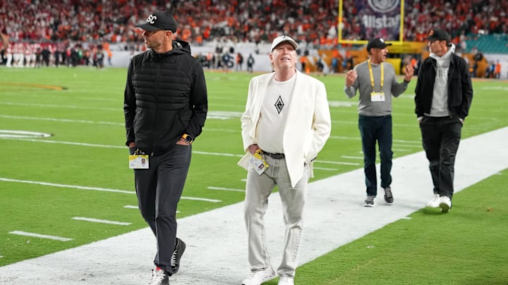Jan 19, 2026; Miami Gardens, FL, USA; Las Vegas Raiders general manager John Spytek and owner Mark Davis walk on the sideline before the CFP National Championship college football game between the Indiana Hoosiers and the Miami Hurricanes at Hard Rock Stadium. Jan 19, 2026; Miami Gardens, FL, USA; Las Vegas Raiders general manager John Spytek and owner Mark Davis walk on the sideline before the CFP National Championship college football game between the Indiana Hoosiers and the Miami Hurricanes at Hard Rock Stadium.