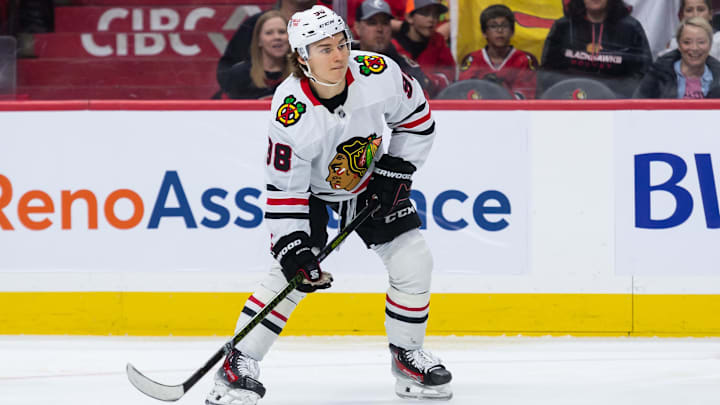 Apr 15, 2025; Ottawa, Ontario, CAN; Chicago Blackhawks center Connor Bedard (98) controls the puck in the second period against the Ottawa Senators at the Canadian Tire Centre. Mandatory Credit: Marc DesRosiers-Imagn Images