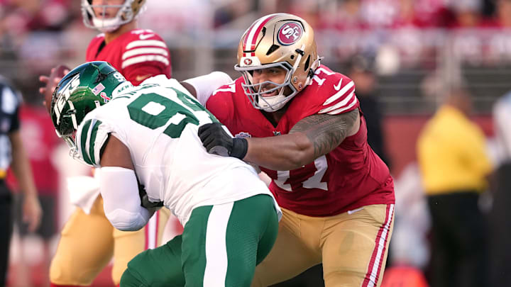 Sep 9, 2024; Santa Clara, California, USA; San Francisco 49ers guard Dominick Puni (77) blocks New York Jets defensive end Solomon Thomas (left) during the first quarter at Levi's Stadium. Mandatory Credit: Darren Yamashita-Imagn Images