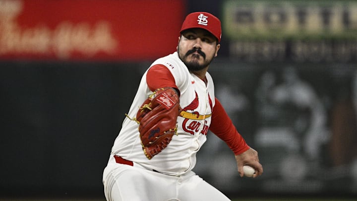 St. Louis Cardinals relief pitcher JoJo Romero (59) pitches against the Cincinnati Reds in the eighth inning at Busch Stadium. 