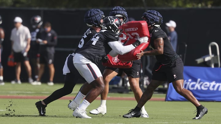 Jul 24, 2025; Houston, TX, USA; Houston Texans tight end Dalton Schultz (86) and tackle Cam Robinson (74) and tight end Brevin Jordan (9) during training camp at Houston Methodist Training Center. Mandatory Credit: Troy Taormina-Imagn Images