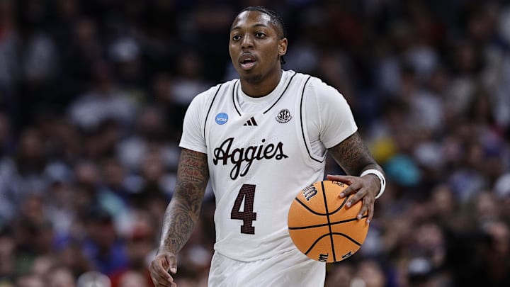 Mar 22, 2025; Denver, CO, USA; Texas A&M Aggies guard Wade Taylor IV (4) dribbles the ball against the Michigan Wolverines during the second half in the second round of the NCAA Tournament at Ball Arena. Mandatory Credit: Isaiah J. Downing-Imagn Images Mar 22, 2025; Denver, CO, USA; Texas A&M Aggies guard Wade Taylor IV (4) dribbles the ball against the Michigan Wolverines during the second half in the second round of the NCAA Tournament at Ball Arena. Mandatory Credit: Isaiah J. Downing-Imagn Images