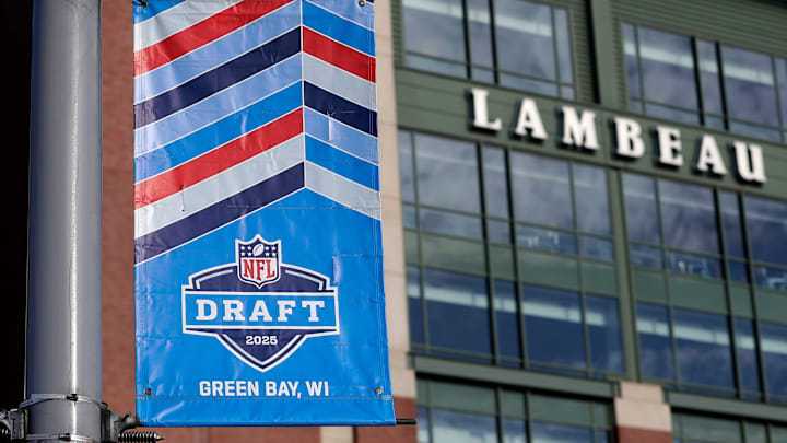 A banner advertising the 2025 NFL Draft on display in the parking lot of Lambeau Field on April 11, 2025, in Green Bay, Wis.