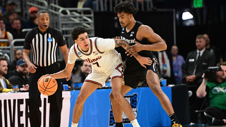 Mar 21, 2025; Milwaukee, WI, USA: Illinois Fighting Illini forward Will Riley (7) drives to the hoop past Xavier Musketeers guard Marcus Foster (1) during the first half at Fiserv Forum. Mandatory Credit: Benny Sieu-Imagn Images