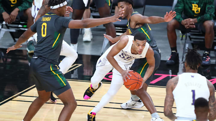 Former Huskies guard Quade Green (55) splits the Baylor defense during a game played in Las Vegas in 2020.
