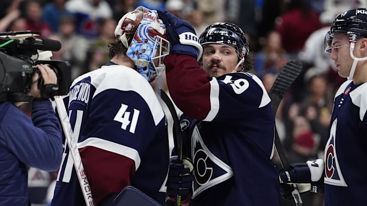 Dec 19, 2025; Denver, Colorado, USA; Colorado Avalanche goaltender Scott Wedgewood (41) and defenseman Samuel Girard (49)  the win over the Winnipeg Jets at Ball Arena. Mandatory Credit: Ron Chenoy-Imagn Images