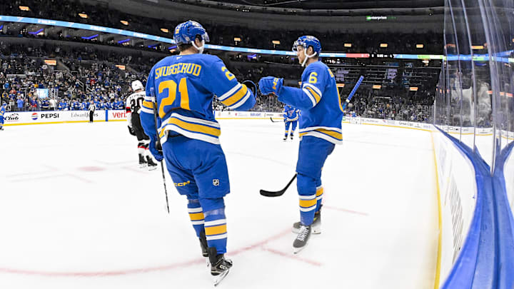 Oct 2, 2025; St. Louis, Missouri, USA; St. Louis Blues defenseman Philip Broberg (6) is congratulated by right wing Jimmy Snuggerud (21) after scoring against the Ottawa Senators during the second period at Enterprise Center. Mandatory Credit: Jeff Curry-Imagn Images