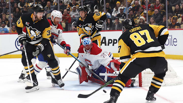 Dec 21, 2025; Pittsburgh, Pennsylvania, USA;  Montréal Canadiens goaltender Jakub Dobes (75) makes a save against Pittsburgh Penguins center Sidney Crosby (87) during the third period at PPG Paints Arena. Mandatory Credit: Charles LeClaire-Imagn Images