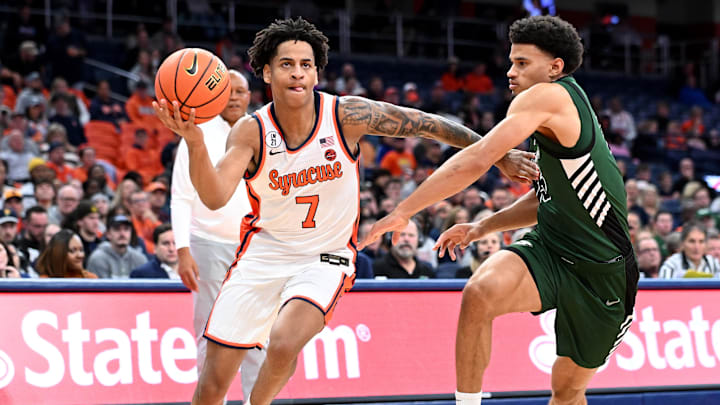 Nov 3, 2025; Syracuse, New York, USA; Syracuse Orange forward Kiyan Anthony (7) drives to basket as Binghamton Bearcats guard Bryson Wilson (15) defends in the second half at the JMA Wireless Dome. Mandatory Credit: Mark Konezny-Imagn Images