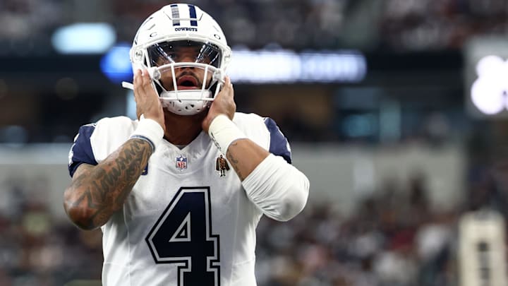 Dallas Cowboys quarterback Dak Prescott looks on prior to the game against the Washington Commanders. Dallas Cowboys quarterback Dak Prescott looks on prior to the game against the Washington Commanders.