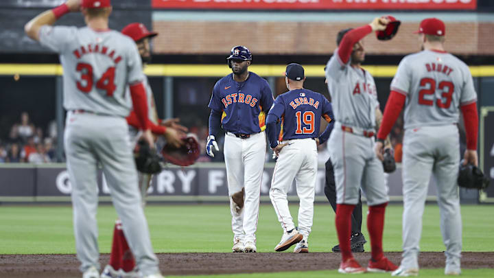 Sep 22, 2024; Houston, Texas, USA; Houston Astros left fielder Yordan Alvarez (44) is evaluated after an apparent injury during the third inning against the Los Angeles Angels at Minute Maid Park.