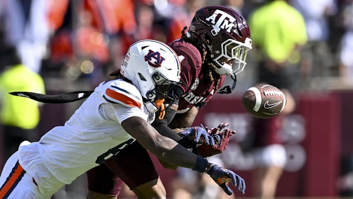 Sep 27, 2025; College Station, Texas, USA; Texas A&M Aggies cornerback Will Lee III (4) breaks up a pass intended for Auburn Tigers wide receiver Cam Coleman (8) during the second quarter at Kyle Field. Mandatory Credit: Maria Lysaker-Imagn Images