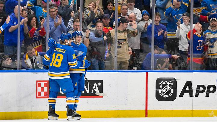Nov 14, 2025; St. Louis, Missouri, USA; St. Louis Blues right wing Jimmy Snuggerud (21) is congratulated by center Robert Thomas (18) after scoring against the Philadelphia Flyers during the first period at Enterprise Center. Mandatory Credit: Jeff Curry-Imagn Images