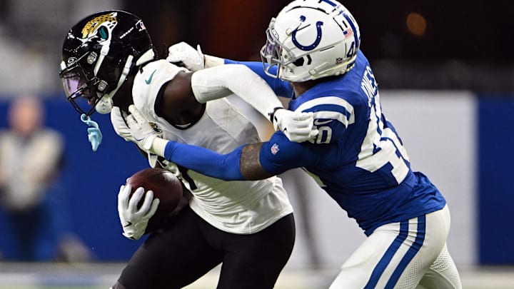 Jan 5, 2025; Indianapolis, Indiana, USA; Indianapolis Colts cornerback Jaylon Jones (40) tackles Jacksonville Jaguars wide receiver Brian Thomas Jr. (7) during the second half at Lucas Oil Stadium. Mandatory Credit: Marc Lebryk-Imagn Images Jan 5, 2025; Indianapolis, Indiana, USA; Indianapolis Colts cornerback Jaylon Jones (40) tackles Jacksonville Jaguars wide receiver Brian Thomas Jr. (7) during the second half at Lucas Oil Stadium. Mandatory Credit: Marc Lebryk-Imagn Images