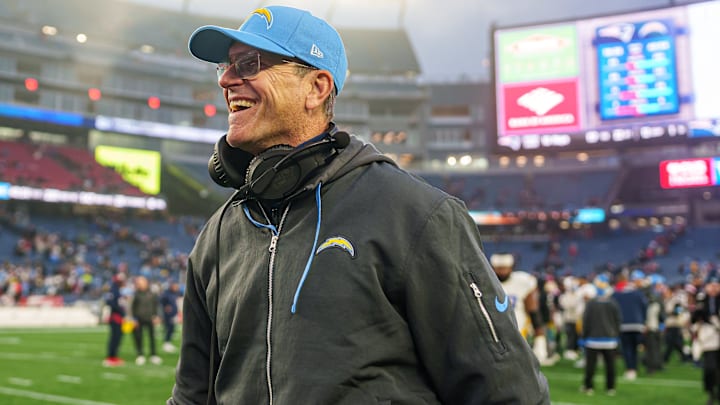 Los Angeles Chargers head coach Jim Harbaugh reacts after defeating the New England Patriots at Gillette Stadium.