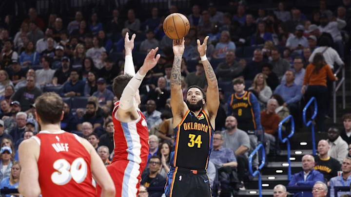 Dec 29, 2024; Oklahoma City, Oklahoma, USA; Oklahoma City Thunder forward Kenrich Williams (34) shoots a three-point basket against the Memphis Grizzlies during the second quarter at Paycom Center. Mandatory Credit: Alonzo Adams-Imagn Images